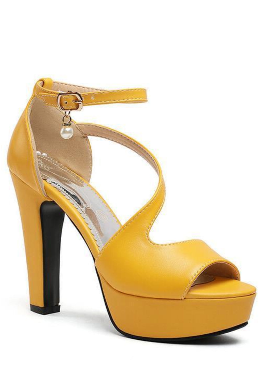 Yellow high-heeled sandal with a platform on a white background