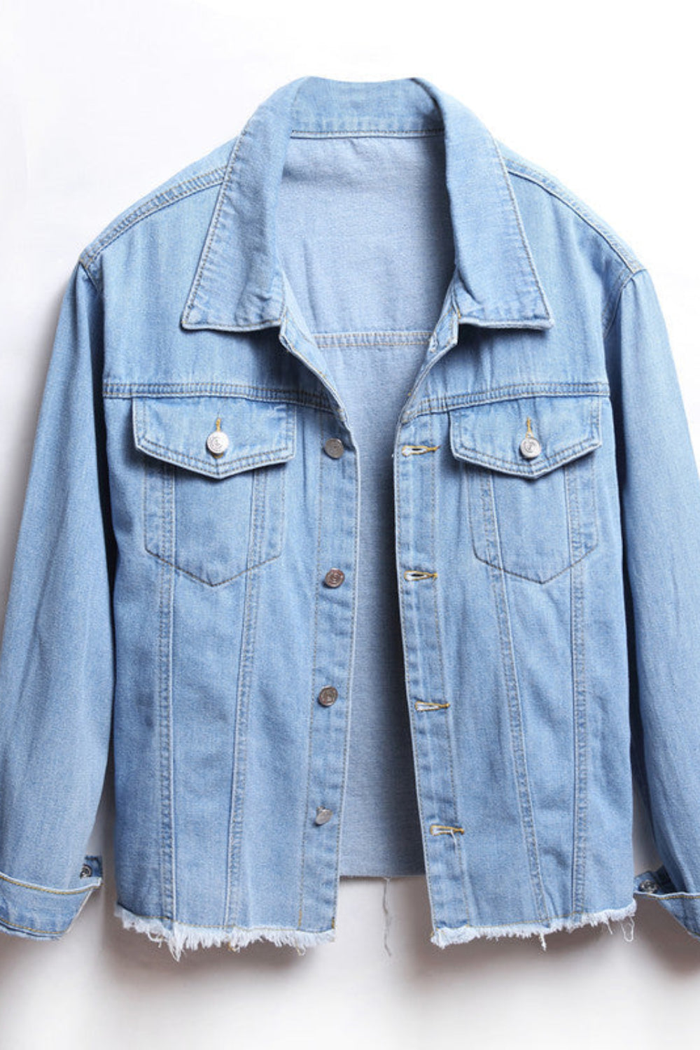 Light blue denim jacket on a white background