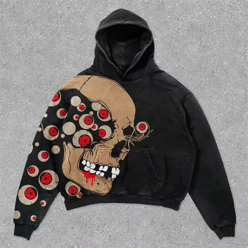 Black hoodie with a skull design on a gray surface