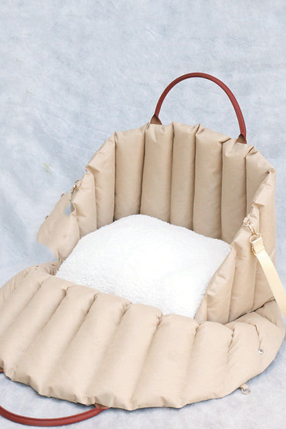 Beige inflatable seat with white cushion on a textured gray background