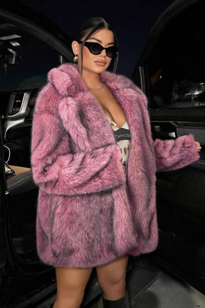 Person wearing a pink fur coat exiting a vehicle.