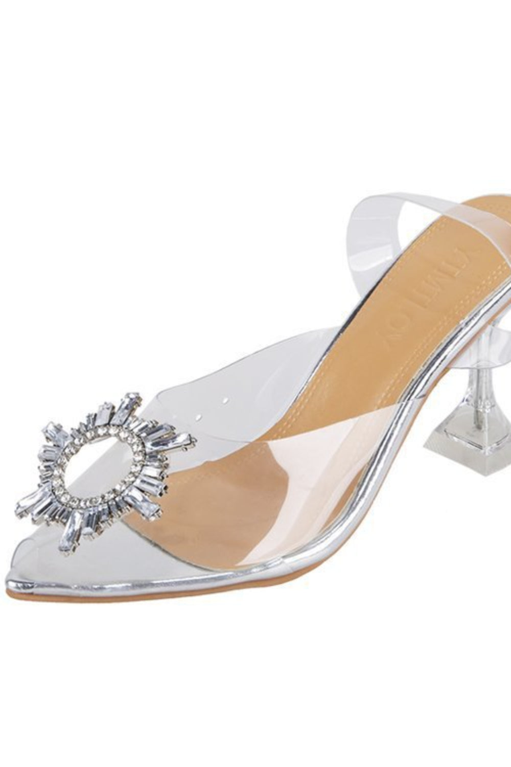 Silver high-heeled shoe with a clear heel and decorative embellishment on a white background