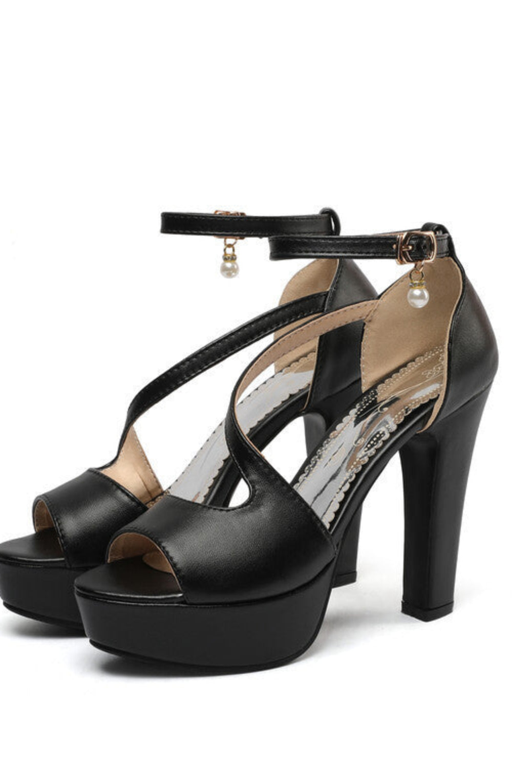 Black high-heeled sandals with ankle strap on a white background