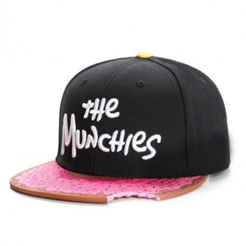 Black cap with pink brim and 'the Munchies' text on a white background