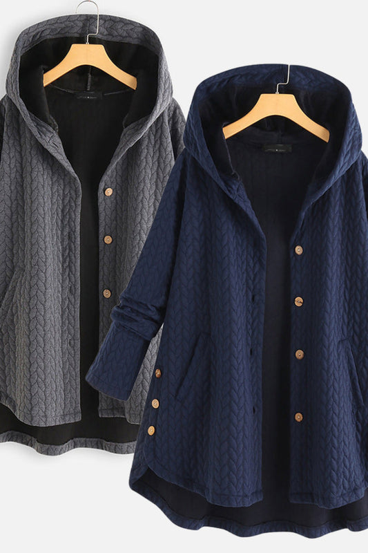 Two hooded jackets, one gray and one navy, on hangers against a white background.