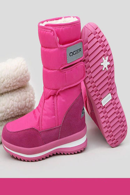 Pink winter boots with a visible brand logo on a light gray background
