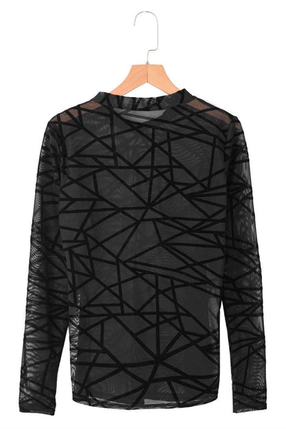 Black geometric patterned shirt on a hanger against a white background