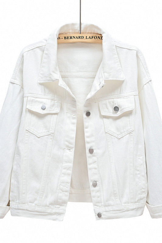 White denim jacket on a hanger with a white background