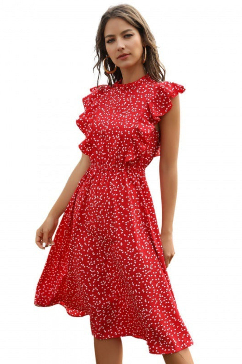 Woman wearing a red floral dress on a white background