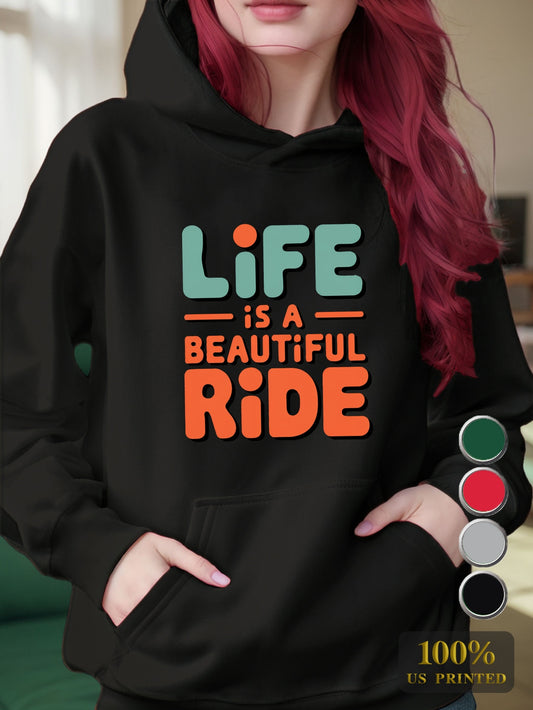 Person wearing a black hoodie with 'Life is a Beautiful Ride' text, colorful swatches below.