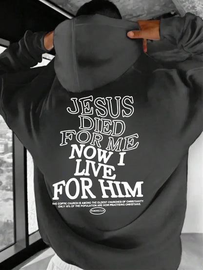Black hoodie with text on the back, worn by a person.