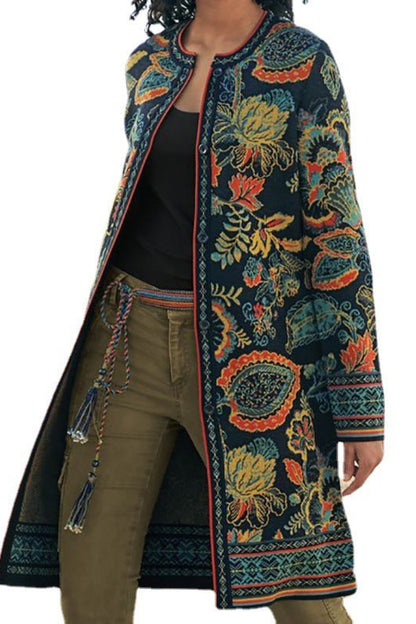 Long, patterned coat with colorful designs on a white background