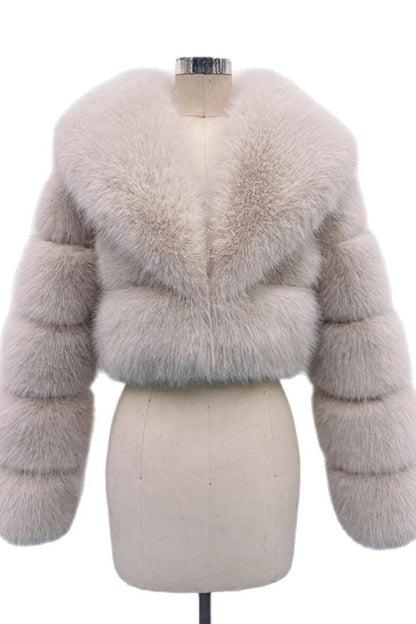 Light gray fur jacket on a mannequin against a white background