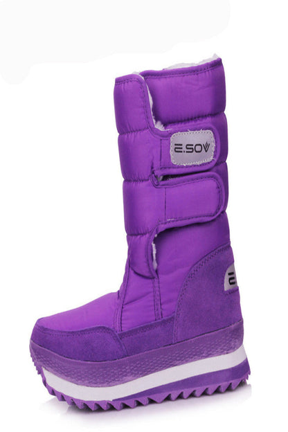 Purple winter boot with white sole on a white background