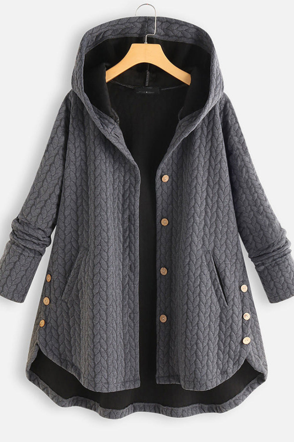 Gray quilted coat with buttons on a hanger against a white background