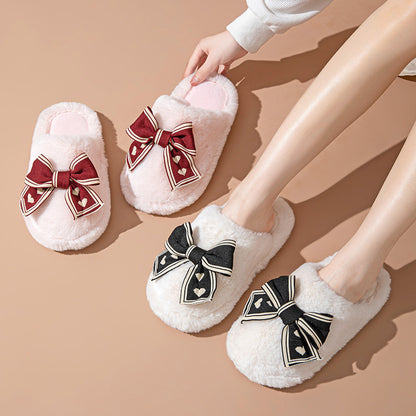 White slippers with decorative bows on a beige background
