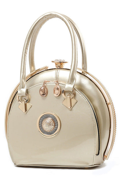 Gold handbag with decorative elements on a white background