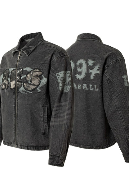 Black denim jacket with graphic designs on a white background