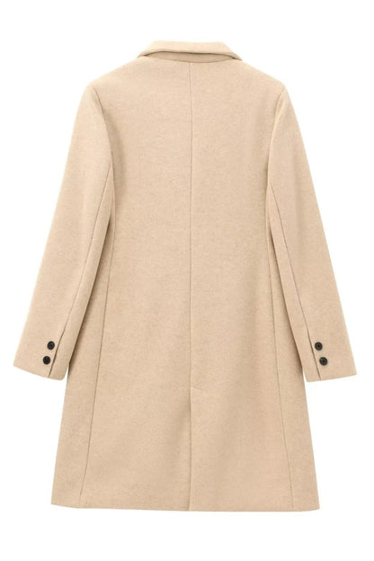 Beige coat on a white background