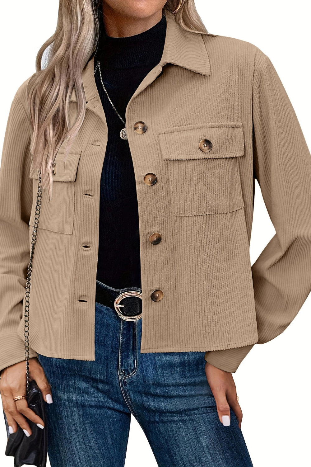 Beige jacket worn by a person on a white background