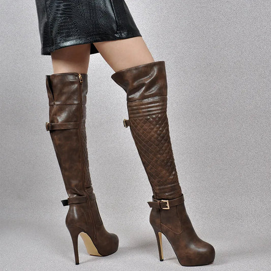Brown knee-high boots with buckles on a gray background