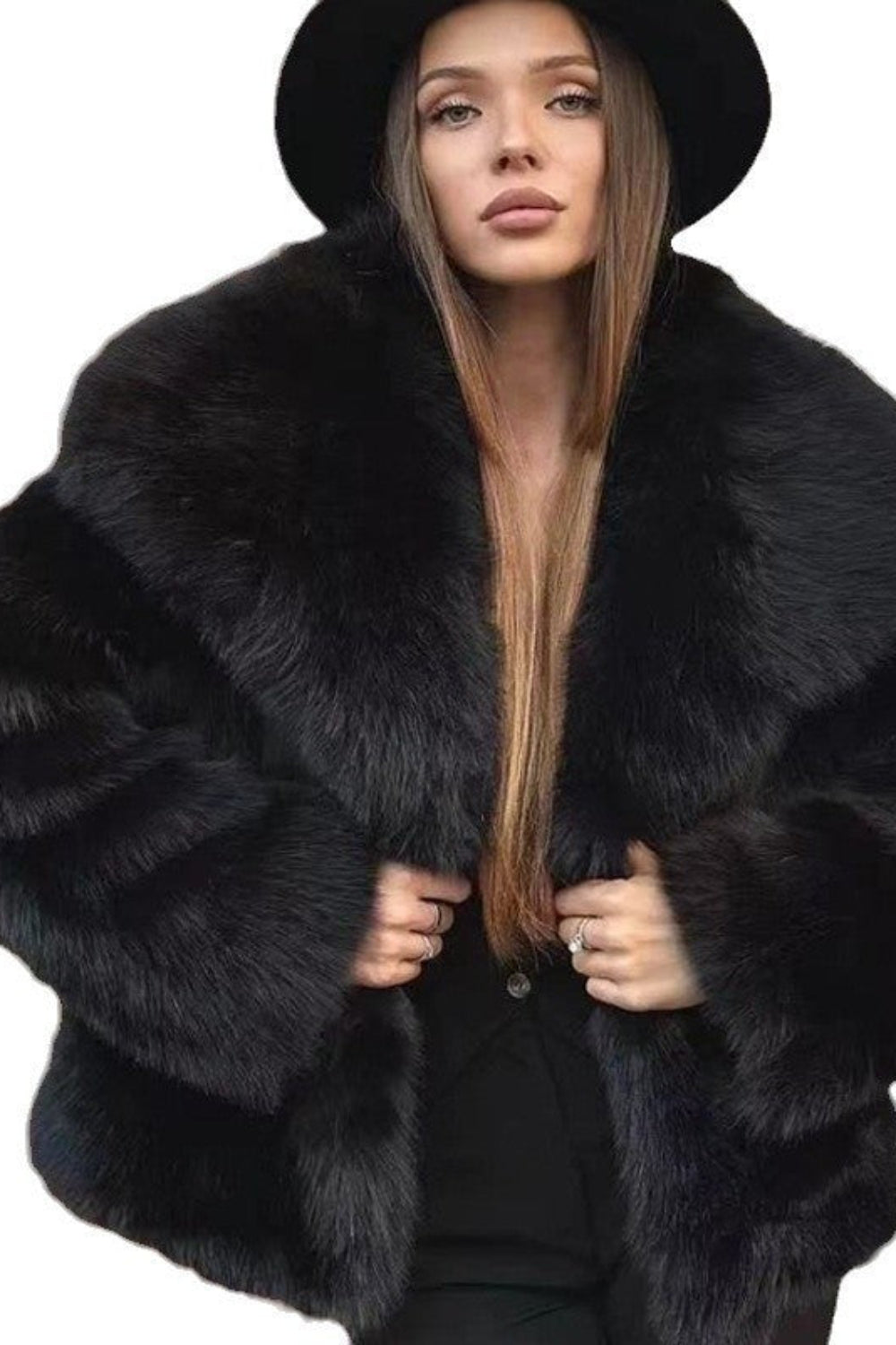 Woman wearing a black fur coat and hat on a white background