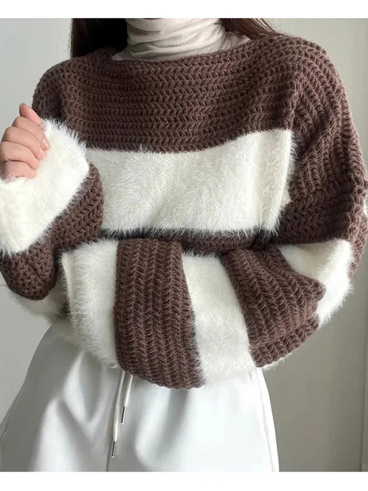 Brown and white striped sweater with fluffy texture on a plain background