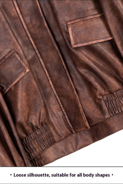 Brown leather jacket with visible stitching and texture on a white background