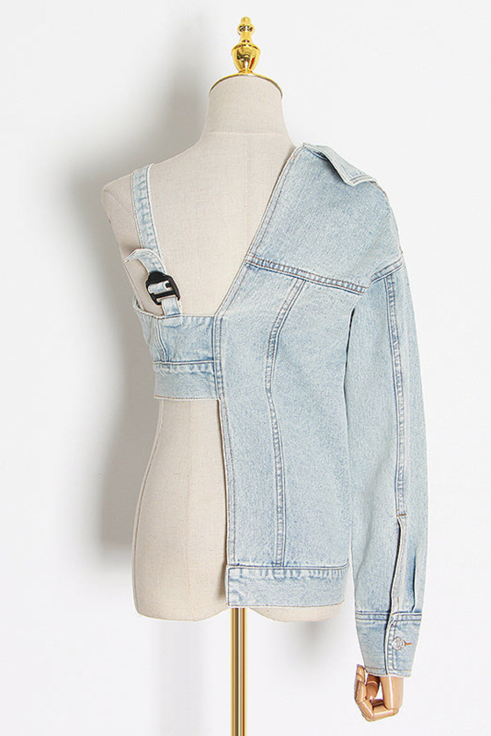 Light blue denim overalls on a mannequin against a white background