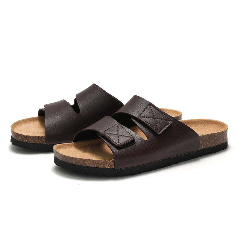 Pair of brown sandals with cork insole on a white background