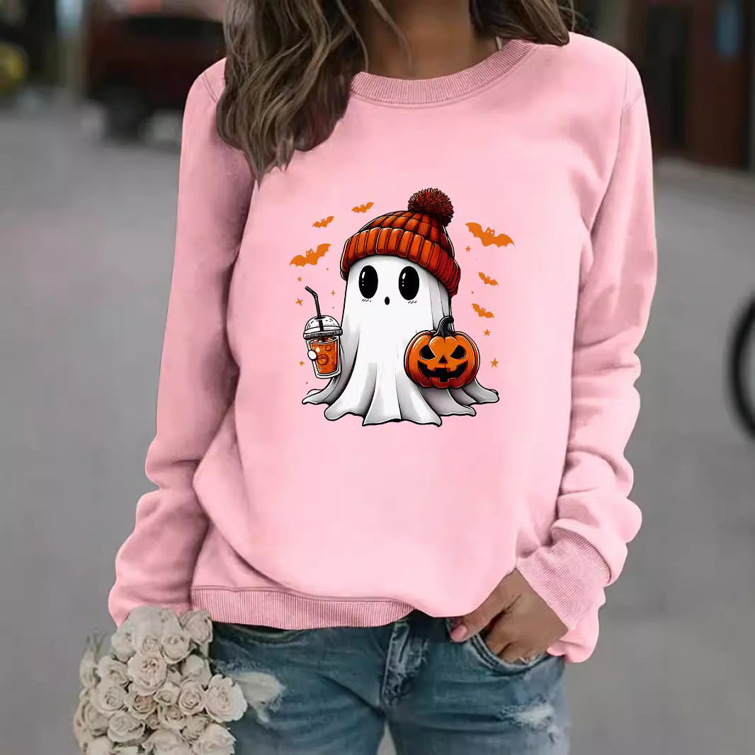 Person wearing a pink sweatshirt with a Halloween-themed ghost design.