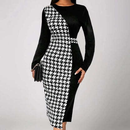 Black and white houndstooth patterned dress on a plain background