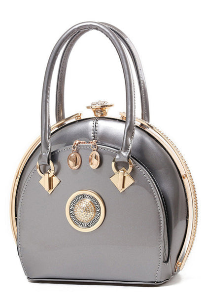 Gray handbag with gold accents on a white background