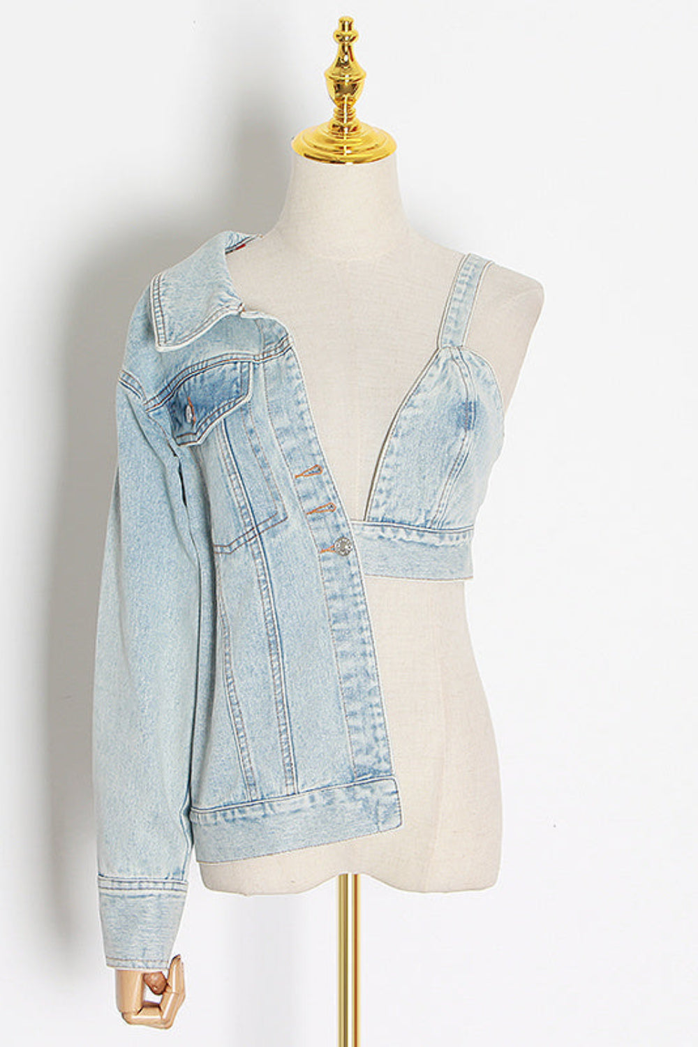 Light blue denim jacket on a mannequin against a white background