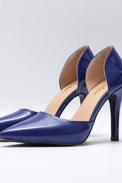 Pair of blue high-heeled shoes on a light gray background