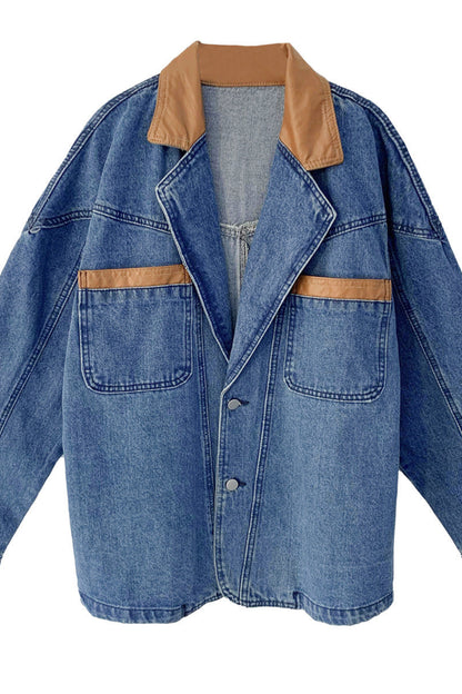 Blue denim jacket with brown leather accents on a white background