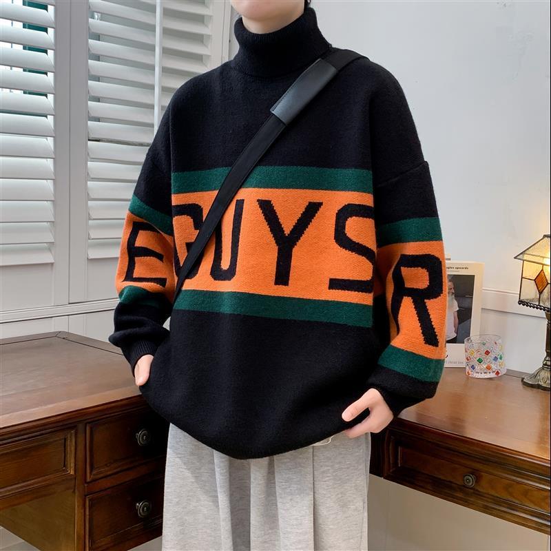 Person wearing a black sweater with orange and green stripes and 'GUYS' text.