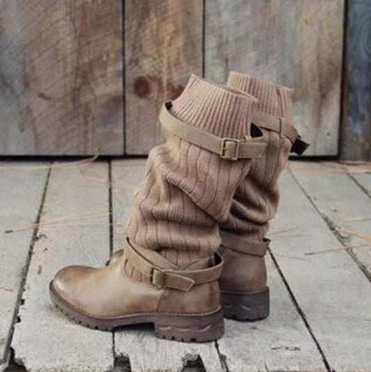 Brown boots with matching leg warmers on a wooden floor.