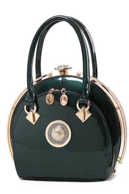 Green handbag with gold accents on a white background