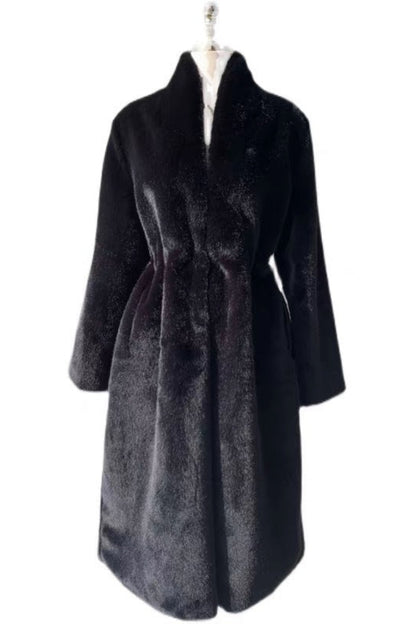 Black fur coat on a mannequin against a white background