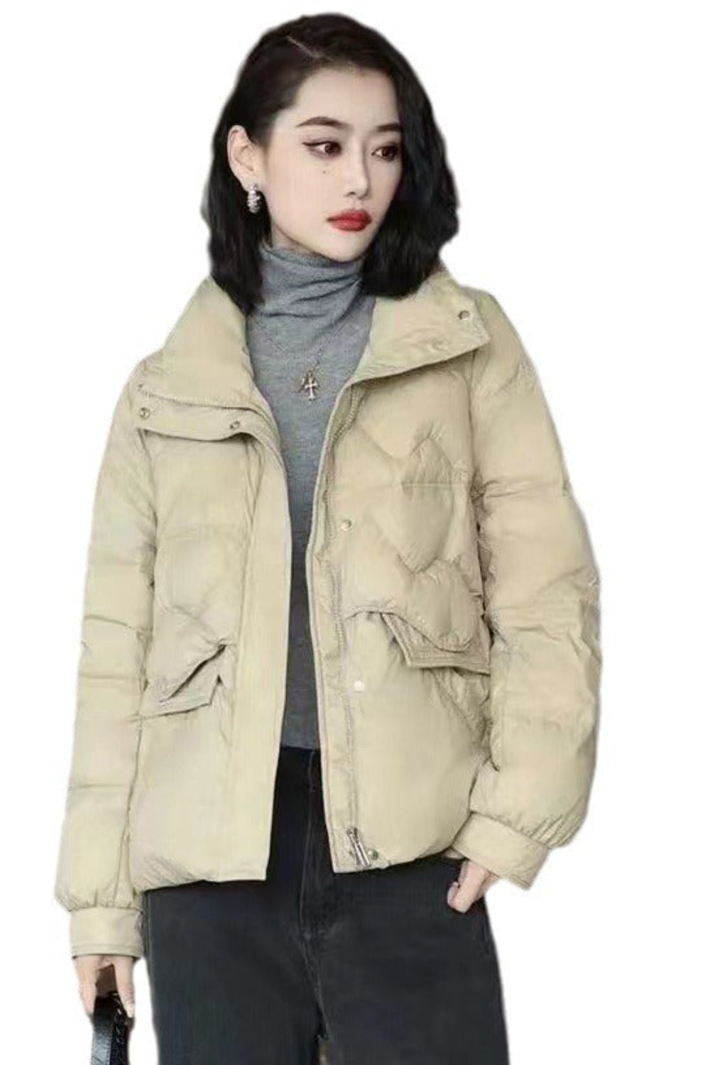 Woman wearing a beige puffer jacket on a white background