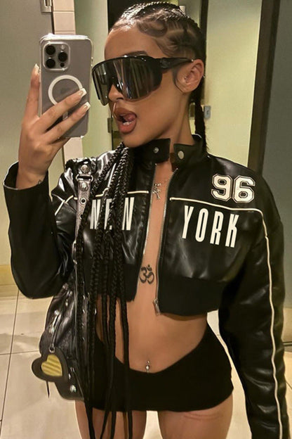 Person wearing a black '96 York' jacket taking a mirror selfie.