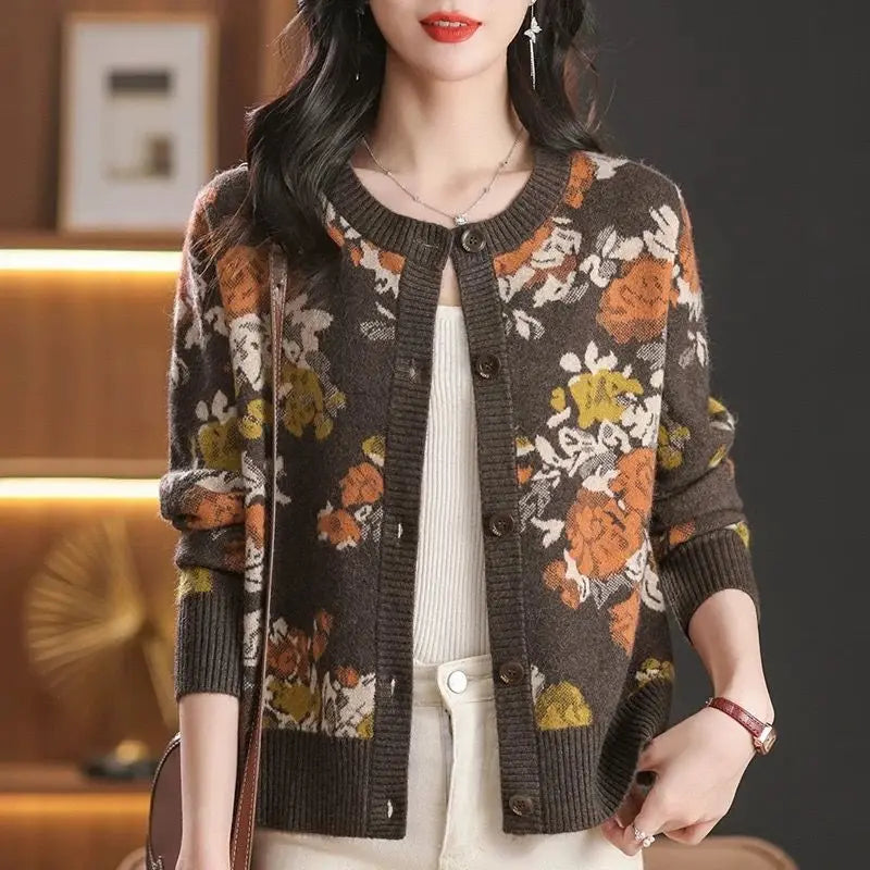 Woman wearing a floral patterned cardigan in an indoor setting