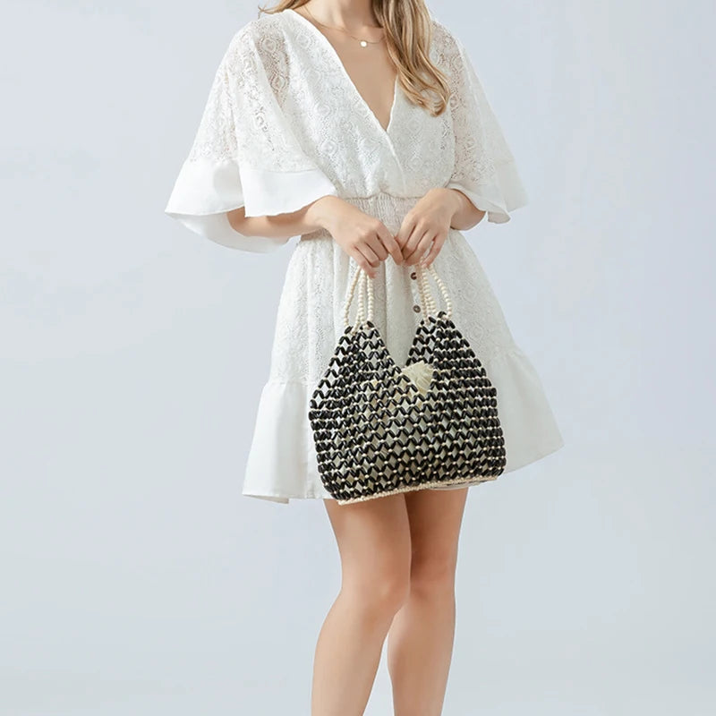 Resort Aesthetics: Chic Pearl Handle Beaded Bag