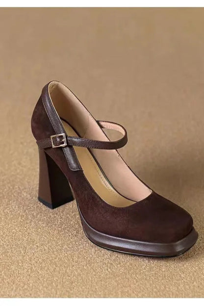Brown high-heeled shoe with a strap on a beige background