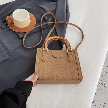 Artisanal Detail: Textured Bamboo-Handle Structured Bag