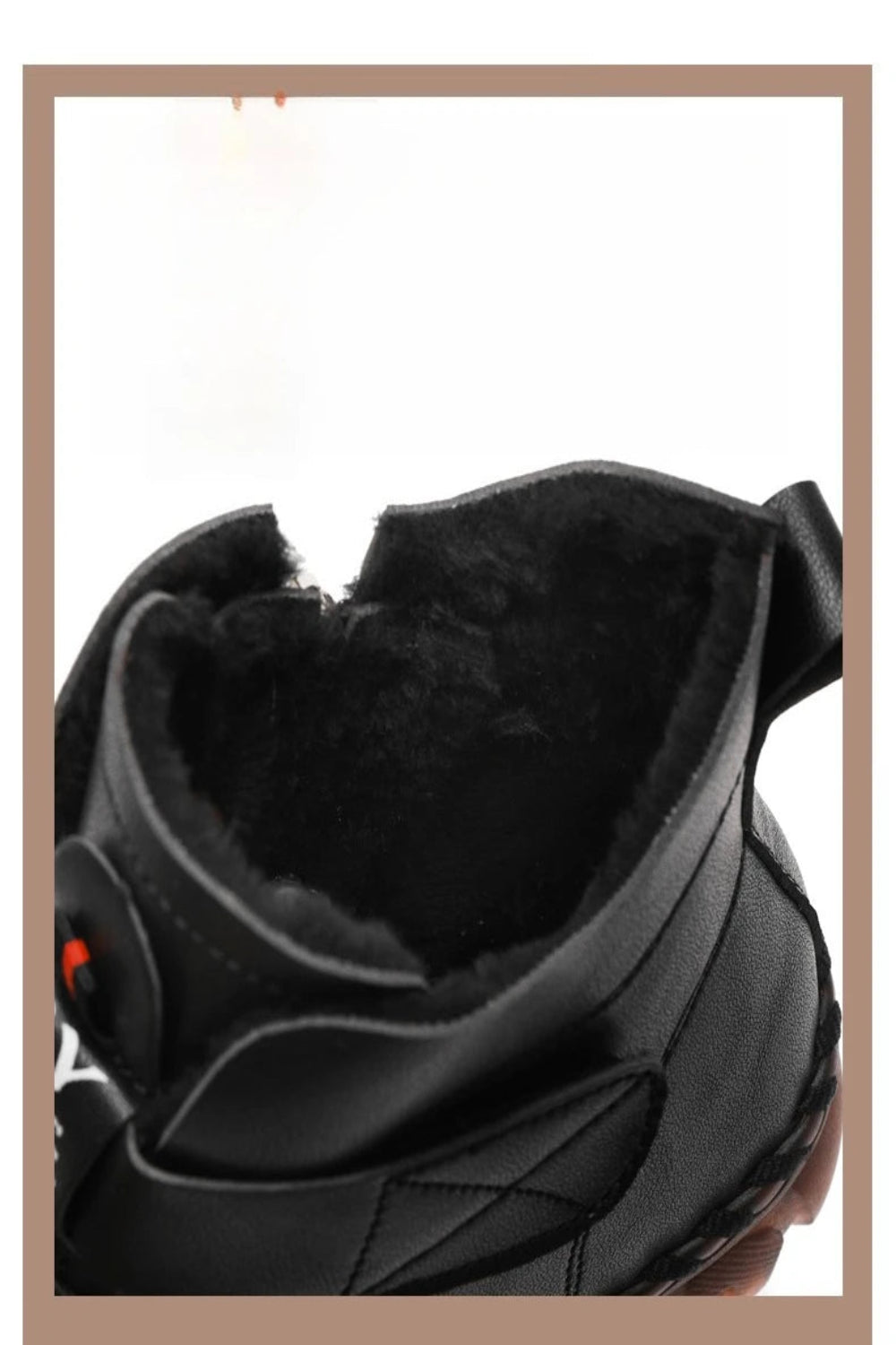 Close-up of a black shoe with fur lining on a white background