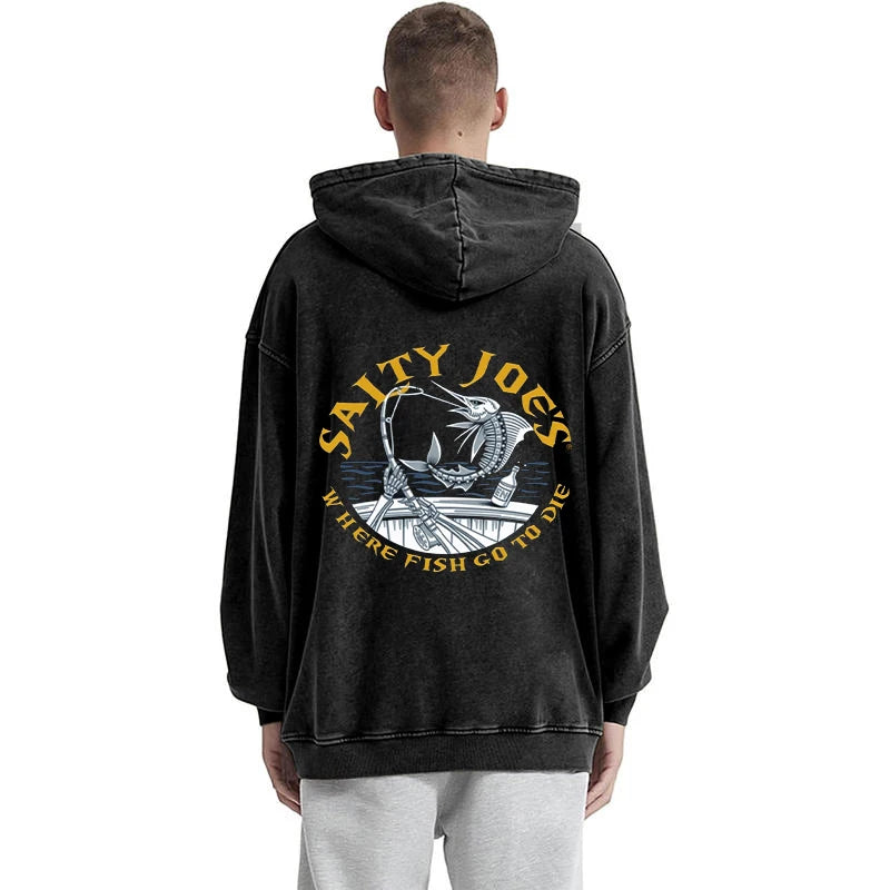 Person wearing a black hoodie with 'Salty Joe's' logo on the back, standing against a white background.