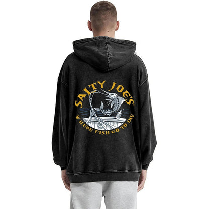 Person wearing a black hoodie with 'Salty Joe's' logo on the back, standing against a white background.