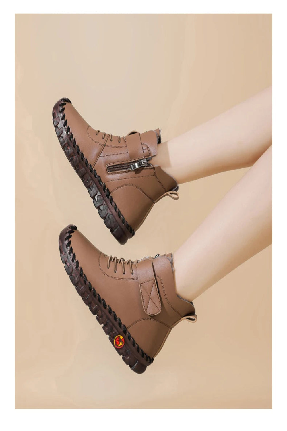 Brown ankle boots with a textured sole on a beige background